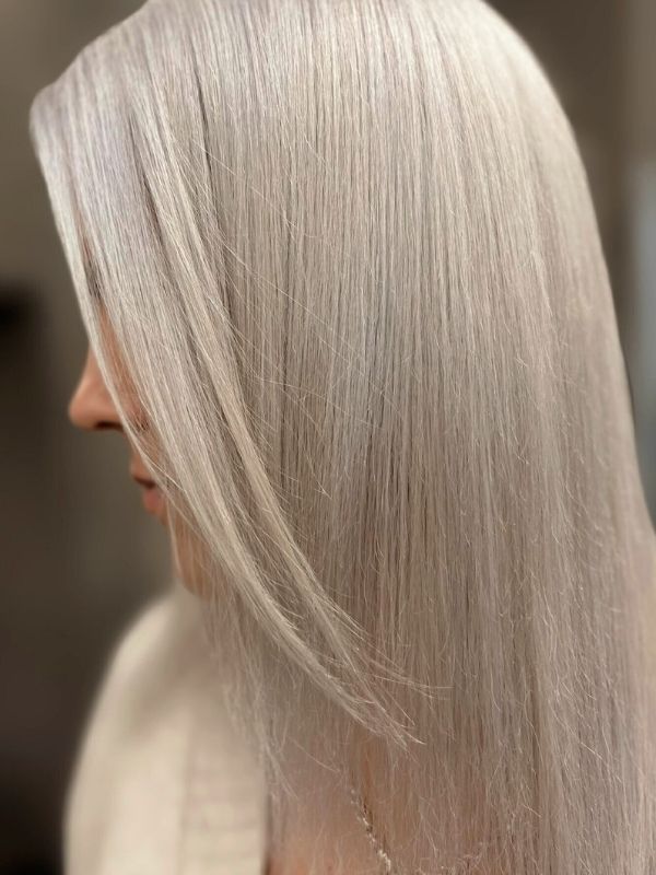 Platinum Blonde hair styled at Niki Newd® Hair Studio – long, luminous strands with a pure, icy tone and elegant shine.