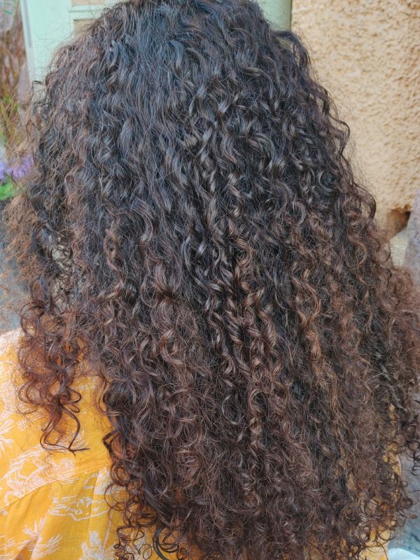Perm by Niki Newd® Hair Studio— defined curls and lively texture for a modern, easy-to-style look.